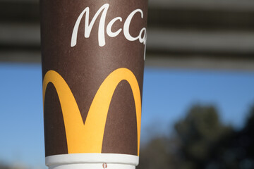 Fototapeta premium McDonald's Canada McCafé large beverage cup outdoors in Toronto