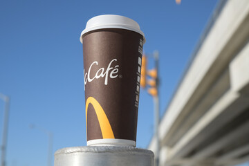 Fototapeta premium McDonald's Canada McCafé large beverage cup outdoors in Toronto