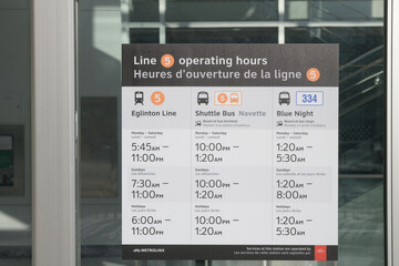 Fototapeta premium Line 5 operating hours sign at Mount Dennis Station, Eglinton Av W, Toronto