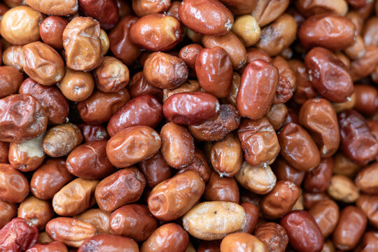 Authentic macro shot of dried oleaster fruits filling the frame. Traditional Anatolian fruit known for its fiber content and mild sweet taste. Natural color, real food photography, no AI generated con