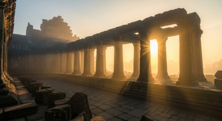 Obraz premium Dramatic Sunrise and Sun Rays over Ancient Angkor Wat Temple Ruins Colonnade in Misty Morning, Siem Reap, Cambodia