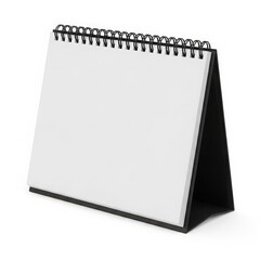 A blank spiral-bound notebook propped up in an open standing position