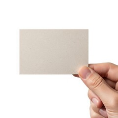 Obraz premium A hand holding a light beige textured card against a plain background.
