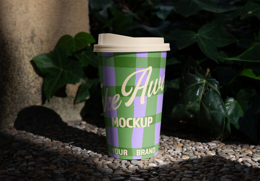 Real photo of take away Coffee Cup on Outdoor Surface. PSD mockup ready for your design.