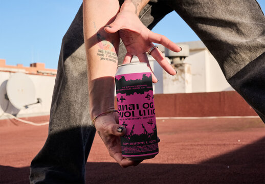 Real photo of Can held by woman with one hand on a rooftop. PSD template mockup ready to use