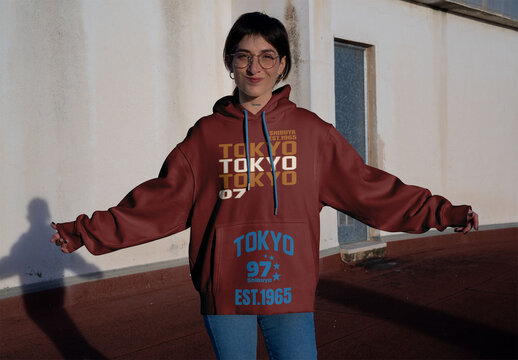 Real photo of Woman Wearing a Hoodie. PSD mockup ready for your use.