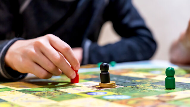 Young man playing a board game