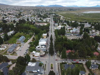 Obraz premium Aerial View of Town with Road and Trees, Patagonia, Argentina, Cloudy Day