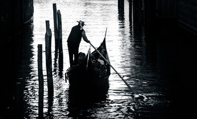 silhouette of a gondolier on the gondola  © Agata Kadar