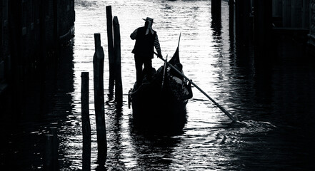 silhouette of a gondolier on the gondola  © Agata Kadar