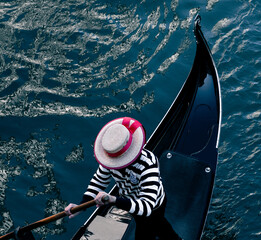 silhouette of a gondolier hat on the gondola 
