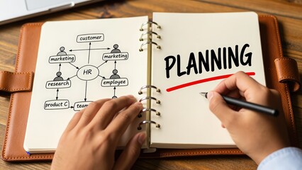 Business Planning Concept Diagram in Notebook with Pen