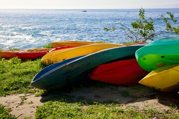 colorful kayaks at the beach