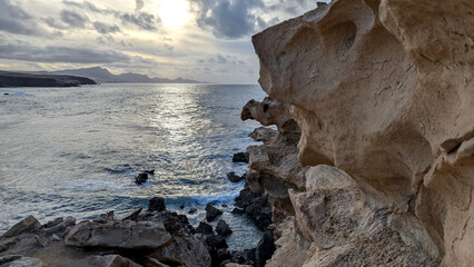 Eroded coastal rocks with the Atlantic Ocean, Fuerteventura © Inha