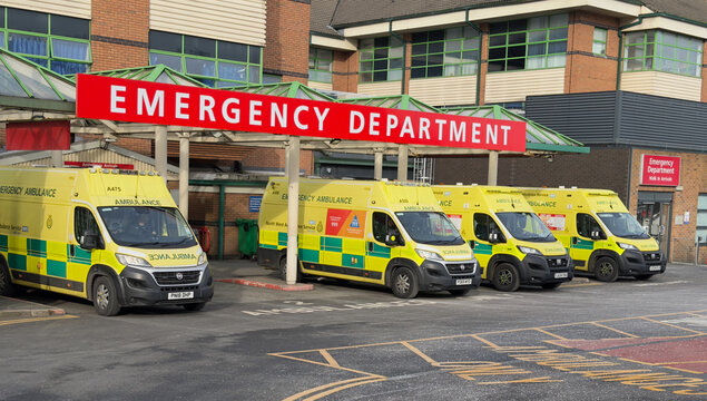NHS North West Ambulance Service ambulances queued   up outside Bolton Royal Hospital accident and emergency department. 