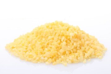Pile of yellow sea salt isolated on white