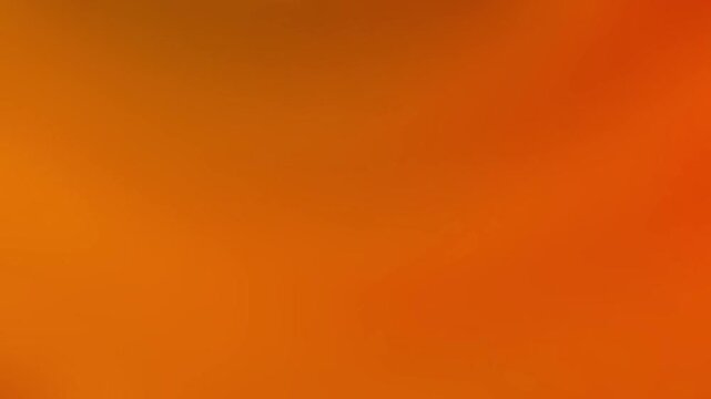 Abstract warm orange gradient background with smooth red undertone transition. Bold and vibrant color blend creates a powerful modern digital backdrop. Ideal for promotional banners, marketing
