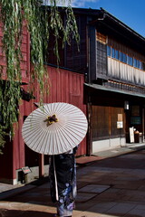 Japanese Girl Posing with Umbrella Dressed in Traditional Geisha Kanazawa Ishikawa Prefecture Japan Higashi Chaya-gai Geisha District