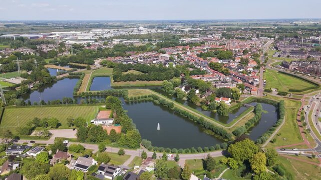 reflective moats angular green fortification lines quiet residential blocks sports fields set amid lowland scenery geertruidenberg netherlands broad fort 