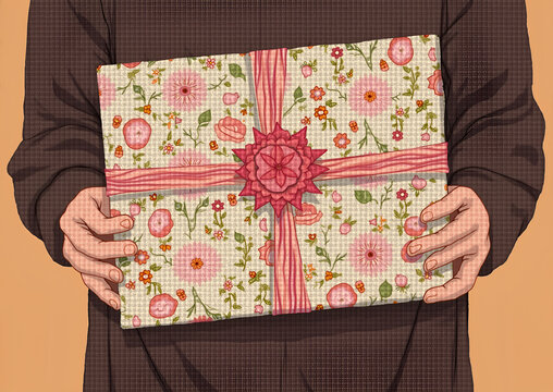 Hands holding a floral patterned gift with pink ribbon, with copy space
