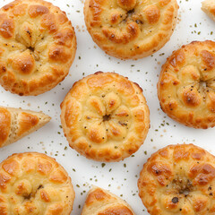 Different delicious puff pastry snacks isolated on white