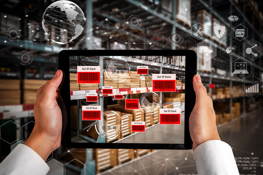 Smart warehouse management system using augmented reality technology to identify package picking and delivery . Future concept of supply chain and logistic business .