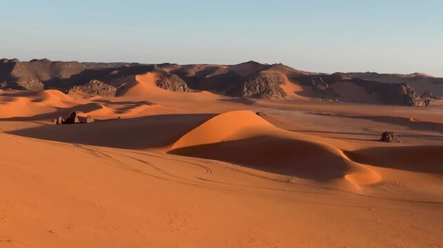 Video travel to Sahara desert in Algeria
with motion effect. Beautiful 
african travel landscape with mountains, rocks,
nature, sun, sand. Summer vacation in arab country.