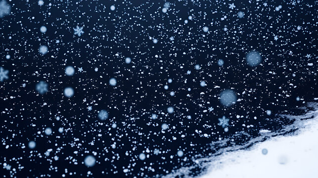Snowflakes settle on the ground in a vast expanse of black, peaceful, cold