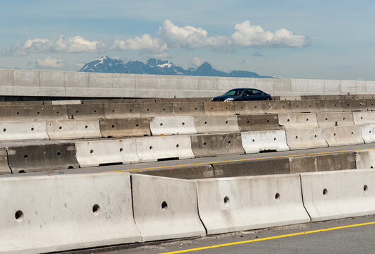 Canada, BC, Coquitlam.   Temporary concrete barriers separate the various entrance and exit ramps during road construction.