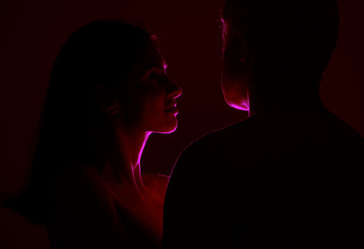silhouette couple love. Couple in love. Man and woman posing studio. Romantic. Sensual. Beauty. Background. Model. 