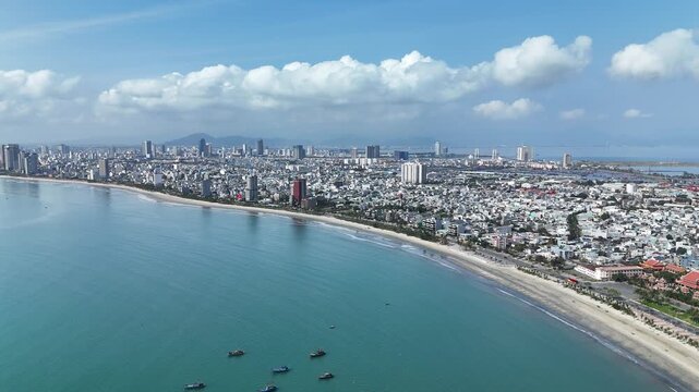 Da Nang, Vietnam &ndash; 4K aerial drone footage of Son Tra Beach, curved coastline, coastal city skyline in the morning