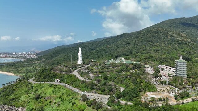 Linh Ung Pagoda, Son Tra Peninsula, Da Nang, Vietnam &ndash; 4K aerial drone footage of Buddhist temple, Lady Buddha statue, coastal mountains and tropical bay