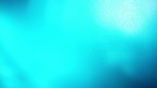 film burn transition with blue and cyan light leak effects, ideal for adding a vintage or dramatic feel to video edits. This visual element is perfect for transitions and overlays.