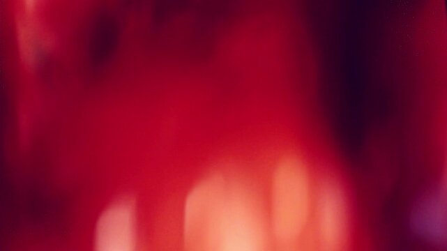 film burn transition with red and orange hues, perfect for transitions and effects. This footage adds cinematic flair to your video projects.