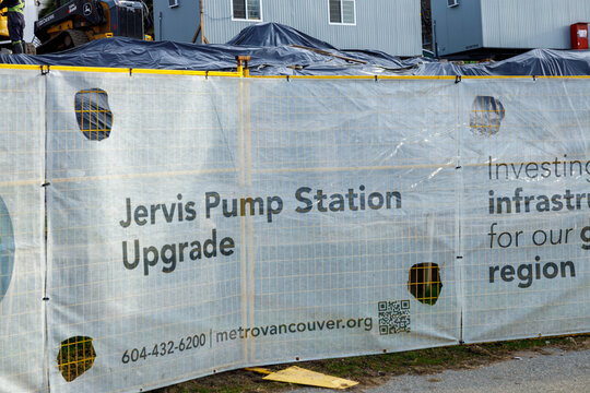 Construction site hoarding for Jervis Pump Station Upgrade project with Metro Vancouver signage