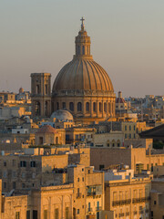 Obraz premium Basilica Sanctuary of Our Lady of Mount Carmel dome at sunset - Valletta, Malta