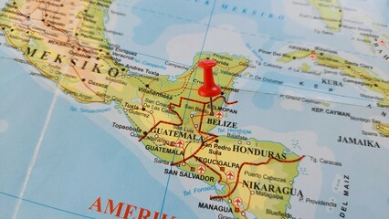 Naklejka premium View of Belize, Country in Central America, on a geographical map of America, marked with red push pin