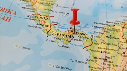 Naklejka premium View of Panama, officially the Republic of Panama, is a country located at the southern end of Central America, bordering South America, on a geographical map of America, marked with red push pin
