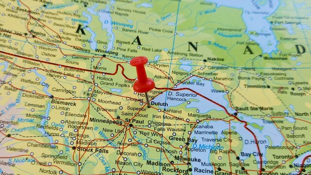 View of Duluth, is a port city in the U.S. state of Minnesota and the county seat of St. Louis County, on a geographical map of America, marked with red push pin