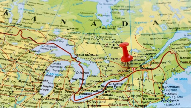 View of Ottawa, is the capital city of Canada. It is located in the southern portion of the province of Ontario, on a geographical map of America, marked with red push pin
