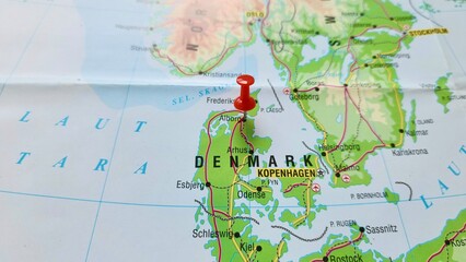 View of Aalborg or Alborg, City in Denmark, on a geographical map of Europe, marked with red push...