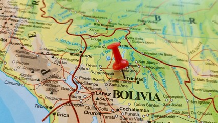 Naklejka premium View of Trinidad, officially La Santisima Trinidad, is a city in Bolivia, capital of the department of Beni, on a geographical map of America, marked with red push pin