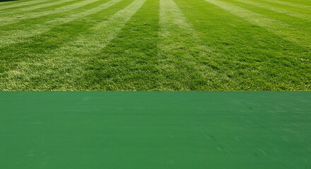 Obraz premium Perfectly Manicured Green Lawn with Striking Parallel Stripes and Lush Texture.