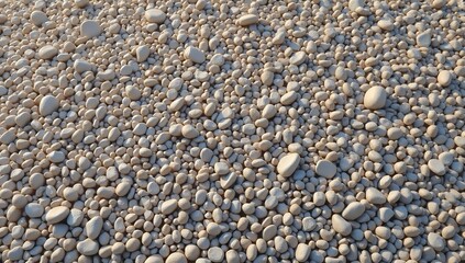 Close up view of a large pile of small smooth pebbles and rocks.