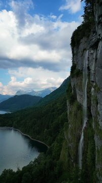Reichenbach Falls in Switzerland Lake Kl&ouml;ntal Swiss alpine nature, aerial drone vertical video