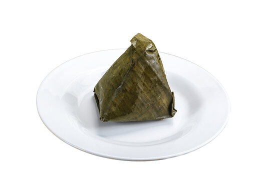 Asian cuisine - rice with filling in banana leaf