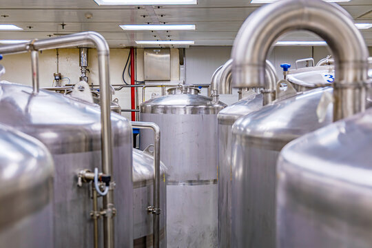 Stainless shiny steel pipes, tanks for the cream cosmetic industry cleaning