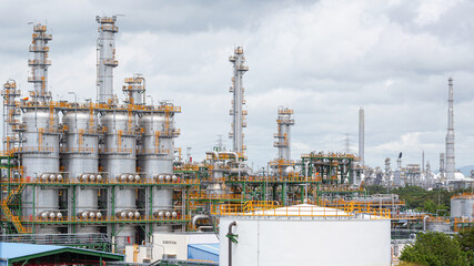 Landscape view of an oil refinery and chemical plant with a blue sky background,