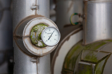 A needle-type temperature gauge is used to monitor and display the temperature inside insulated pipelines in industrial plants.