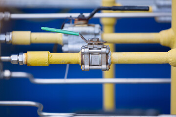 A hand-operated ball valve installed in chemical plant pipes provides precise manual control of flow, ensuring safety,
